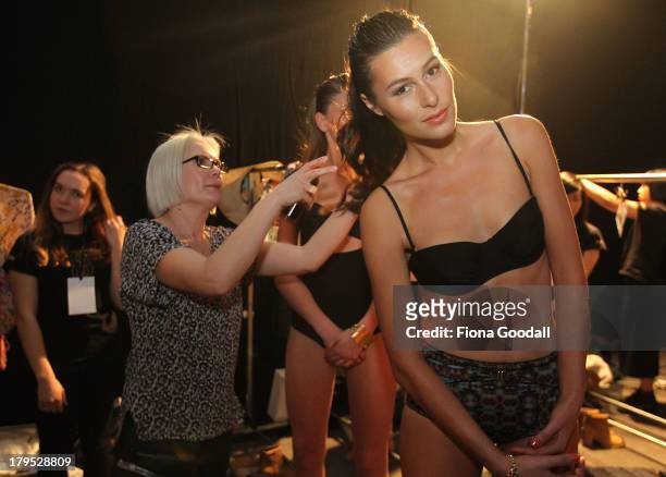 Model prepares backstage ahead of the Surface Too Deep show during New Zealand Fashion Week at the Viaduct Events Centre on September 5, 2013 in...
