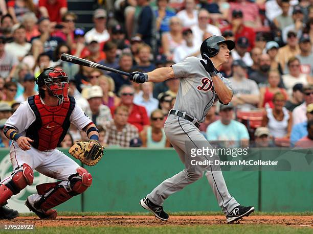 Andy Dirks of the Detroit Tigers swings at a pitch in the seventh inning against the Boston Red Sox at Fenway Park on September 2, 2013 in Boston,...