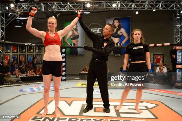 Peggy Morgan celebrates after defeating Bethany Marshall in their elimination fight during filming of season eighteen of The Ultimate Fighter on May...