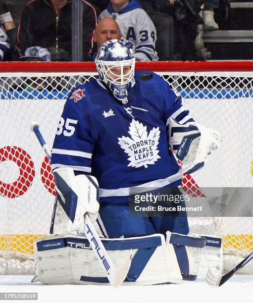 Ilya Samsonov of the Toronto Maple Leafs takes a shit to the mask against the Vancouver Canucks at Scotiabank Arena on November 11, 2023 in Toronto,...