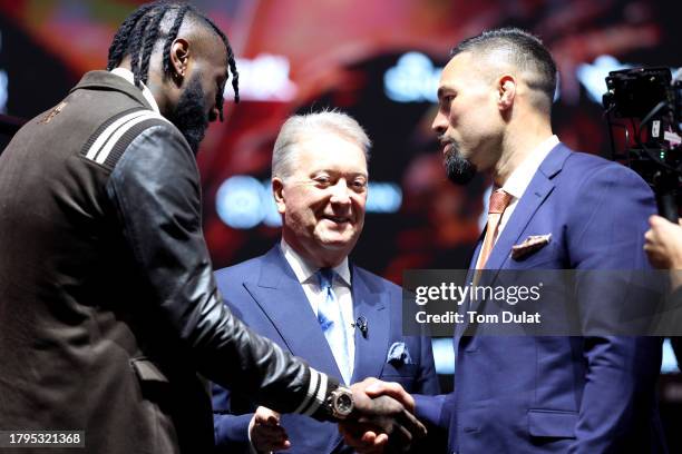 Deontay Wilder of United States and Joseph Parker of New Zealand interact during the Day Of Reckoning Press Conference at OVO Arena Wembley on...