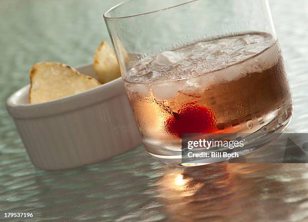 cocktail with maraschino cherry closeup - maraschino stock pictures, royalty-free photos & images