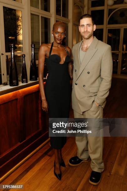 Sheila Atim and Oliver Jackson-Cohen attend the British GQ Men Of The Year enjoying Don Julio 1942 cocktails at the Royal Opera House on November 15,...