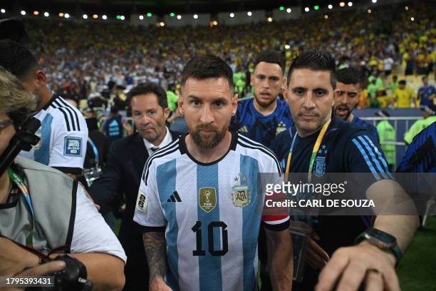 Argentina's forward Lionel Messi leaves the field due to incidents in the stands before the start of the 2026 FIFA World Cup South American...