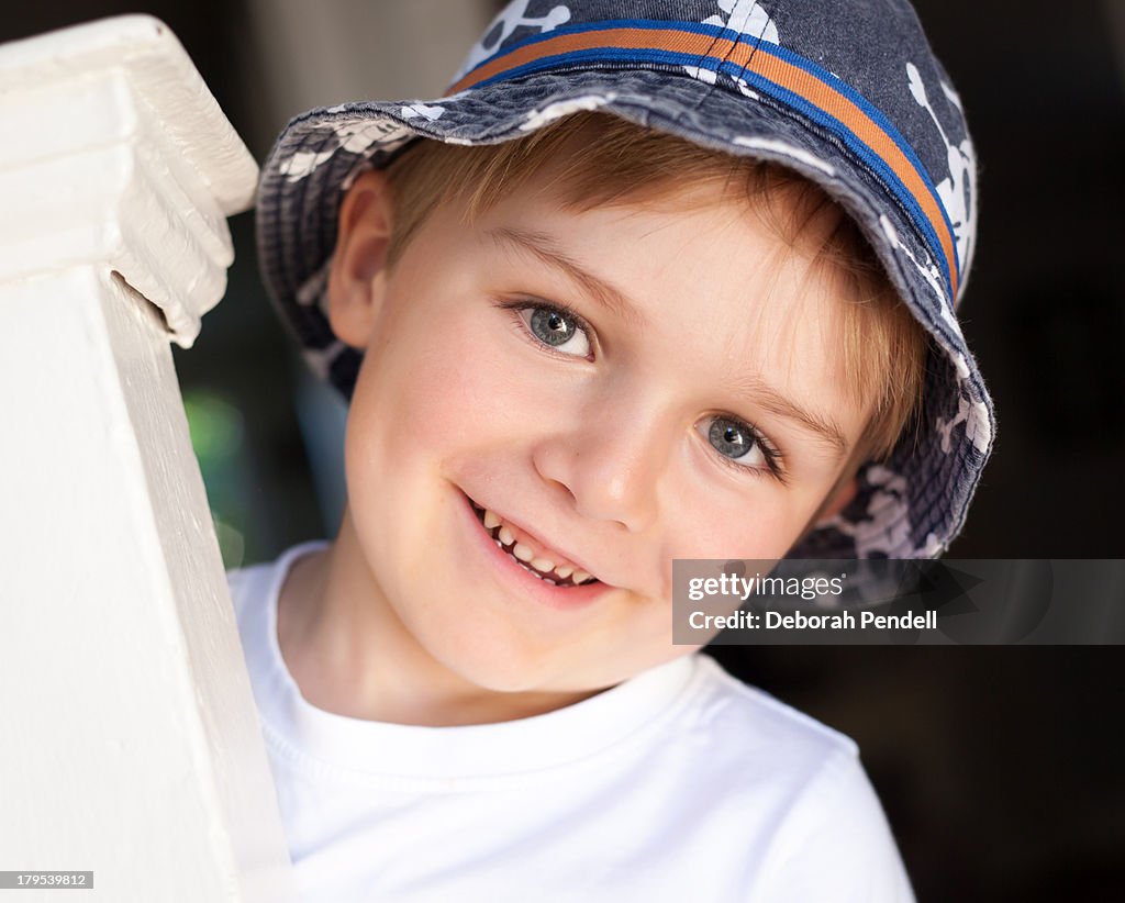 Portrait of young boy wearing a sun hat
