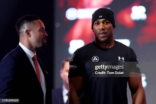 Joseph Parker of New Zealand and Anthony Joshua of Great Britain interact during the Day Of Reckoning Press Conference at OVO Arena Wembley on...