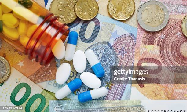 eu currency, euro banknotes and medical pills - euro symbol stock pictures, royalty-free photos & images