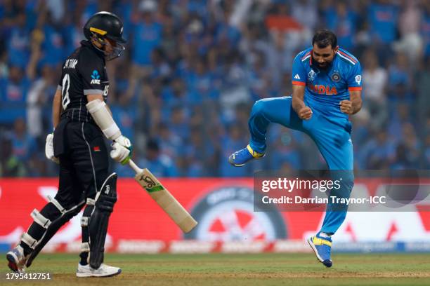 Mohammed Shami of India celebrates after successfully appealing for the wicket of Tom Latham of New Zealand during the ICC Men's Cricket World Cup...