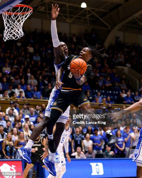 Khalil Brantley of the La Salle Explorers goes to the basket against Mark Mitchell of the Duke Blue Devils during the first half of the game at...