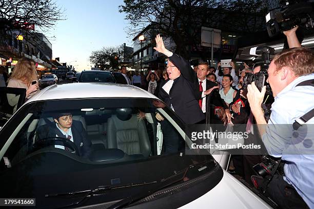 Australian Prime Minister, Kevin Rudd waves to voters in Western Sydney as he gets in his car, on September 5, 2013 in Sydney, Australia. After...