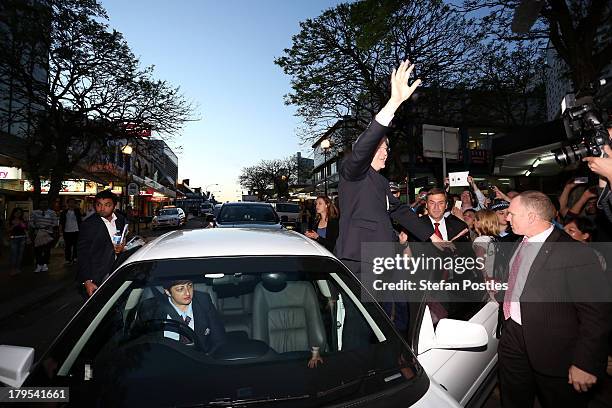 Australian Prime Minister, Kevin Rudd waves to voters in Western Sydney as he gets in his car, on September 5, 2013 in Sydney, Australia. After...