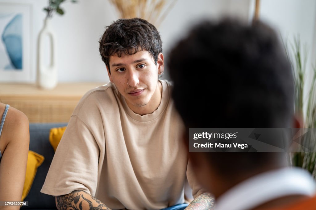 Young man listening to a friend.