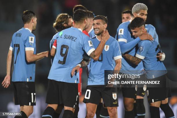 Uruguay players celebrate after defeating Bolivia during the 2026 FIFA World Cup South American qualification football match between Uruguay and...