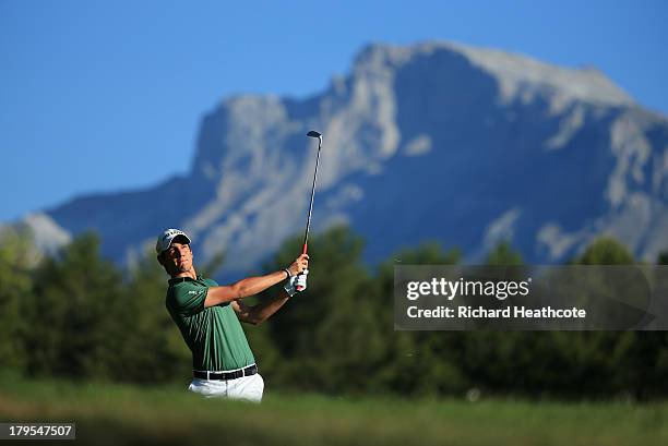 Matteo Manassero of Italy plays into the 12th green during the first round of the Omega European Masters at the Crans-sur-Sierre Golf Club on...