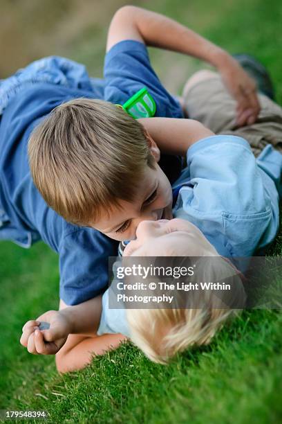 boys wrestling and playing - boys wrestling stock pictures, royalty-free photos & images