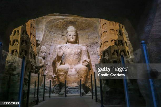 Printing of the 9.93-meter main Buddha Amitababa in Cave 3 of the Yungang Grottoes is displayed at the Yungang Grottoes Art Museum in the West Coast...