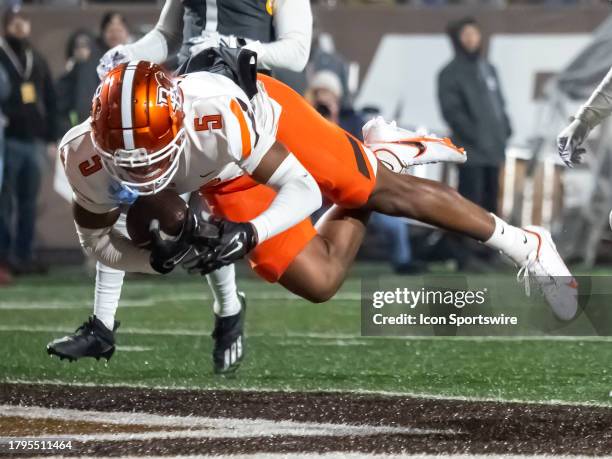 Bowling Green Falcons running back Nick Mosley dives into the end zone for a touchdown during the college football game between the Ball State...