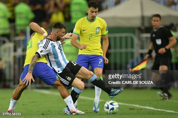 Argentina's forward Lionel Messi and Brazil's midfielder Andre fight for the ball during the 2026 FIFA World Cup South American qualification...