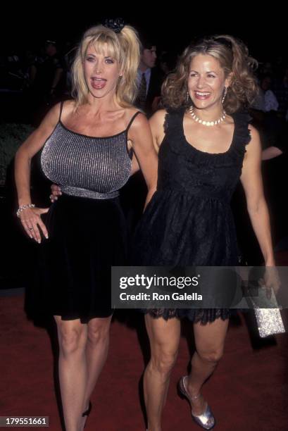 Pandora Peaks and Kimberly Flynn attend the premiere of "Striptease" on June 23, 1996 at the Ziegfeld Theater in New York City.