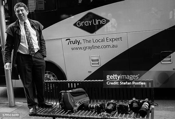 Bus driver stands on a bench talking to members of the media on September 4, 2013 in Melbourne, Australia. Australian voters will head to the polls...