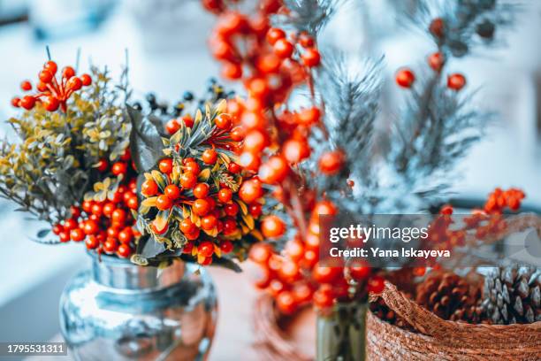 abstract christmas snowy background with red winter rowan berries or sea buckthorn - buckthorn stock pictures, royalty-free photos & images