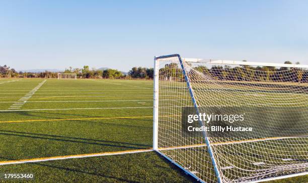 outdoor soccer field without people at daytime - soccer goal stock-fotos und bilder