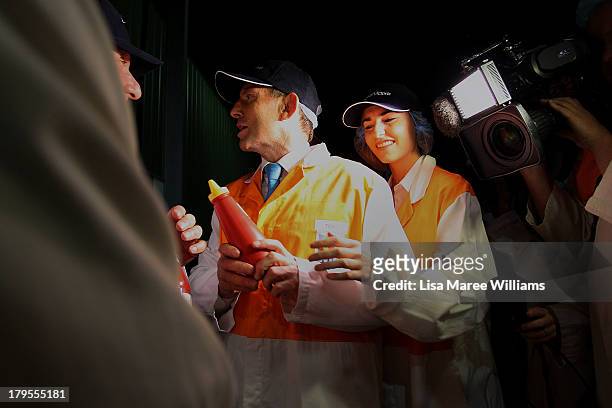 Opposition Leader, Tony Abbott and daughter Frances Abbott take a tour of the Rosella Factory on September 5, 2013 in Dandenong, Australia. The...