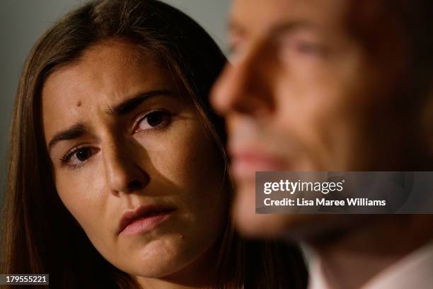 Opposition Leader, Tony Abbott addresses the media as his daughter Frances Abbott looks on at the Rosella Factory on September 5, 2013 in Dandenong,...