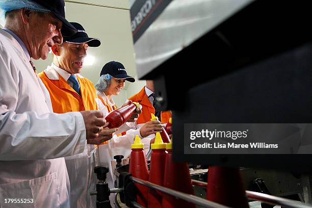 Opposition Leader, Tony Abbott and daughter Frances Abbott take a tour of the Rosella Factory on September 5, 2013 in Dandenong, Australia. The...