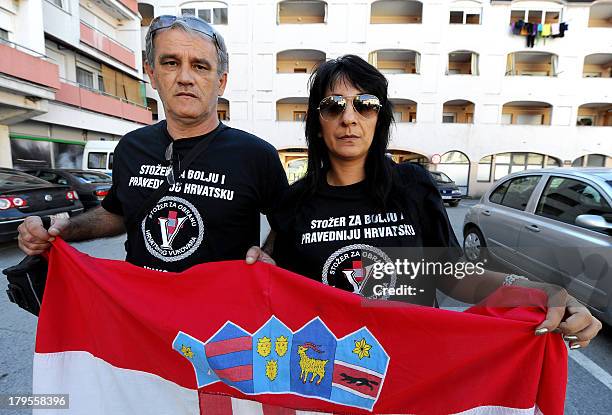 Croatian war veteran Darko Solic and his companion Drazena Celan both from the coastal town of Split, join a protest on September 4, 2013 in Vukovar....