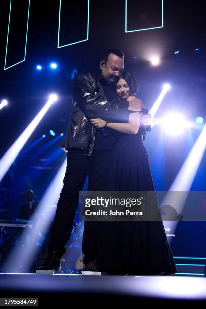 Pepe Aguilar and Ángela Aguilar embrace onstage during the Latin Recording Academy Person of The Year Honoring Laura Pausini at FIBES Conference and...