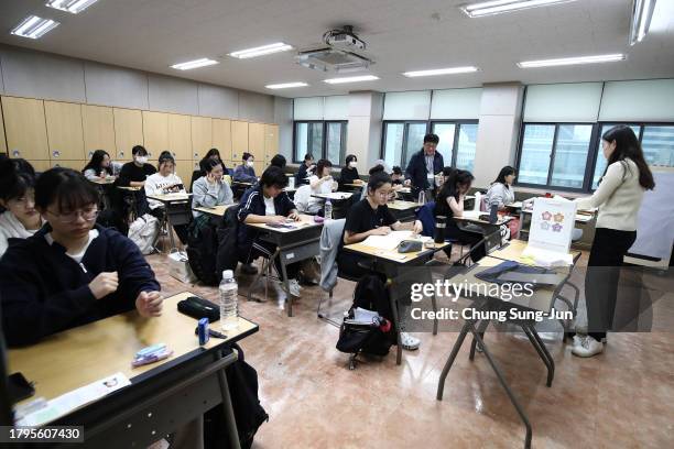 South Korean students wait to take the annual College Scholastic Ability Test at a school on November 16, 2023 in Seoul, South Korea. The annual...