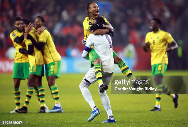 Bobby Reid of Jamaica celebrates after the final whistle with Andre Blake during a CONCACAF Nations League match against Canada at BMO Field on...