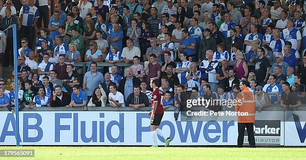 Roy O'Donovan of Northampton Town walks past Bristol Rovers fans after being sent off during the Sky Bet League Two match between Bristol Rovers and...