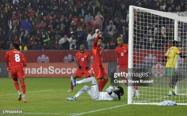 Canada forward Cyle Larin , Canada forward Tajon Buchanan and Canada Derek Cornelius celebrate a goal by Canada Ismael Kone as Canada falls Jamaica...