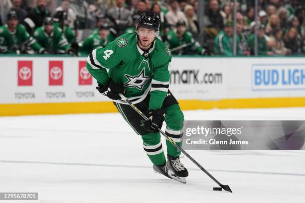 Miro Heiskanen of the Dallas Stars handles the puck against the Arizona Coyotes at the American Airlines Center on November 14, 2023 in Dallas, Texas.