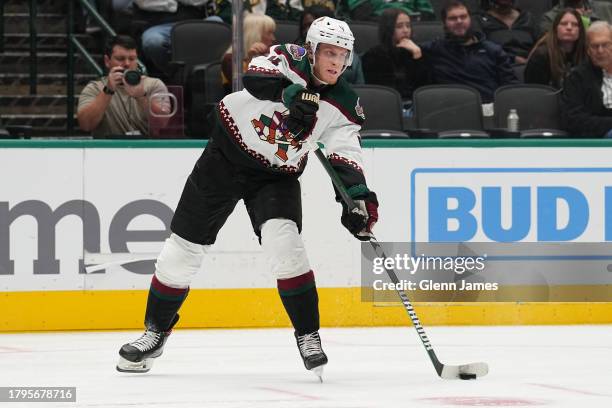 Juuso Valimaki of the Arizona Coyotes handles the puck against the Dallas Stars at the American Airlines Center on November 14, 2023 in Dallas, Texas.