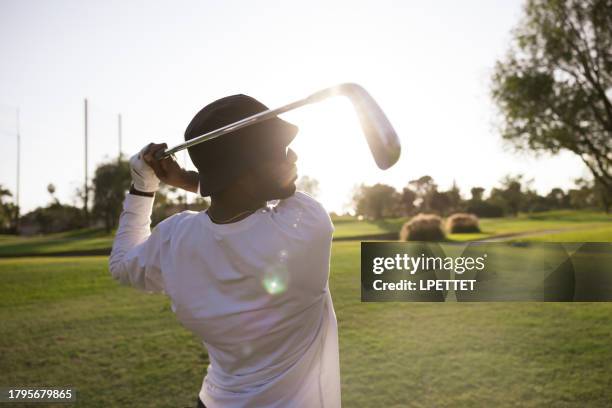 golfing - golf swing sunset stock pictures, royalty-free photos & images