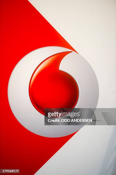 The Vodafone logo is seen at the wall outside the booth of British telecommunications company Vodafone at the 53rd IFA electronics trade fair in...