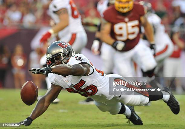 Running back Mike James of the Tampa Bay Buccaneers dives for a pass in the 1st quarter against the Washington Redskins August 29, 2013 at Raymond...