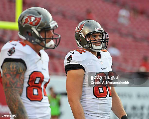 Tight end Nate Byham of the Tampa Bay Buccaneers warms up for play against the Washington Redskins August 29, 2013 at Raymond James Stadium in Tampa,...