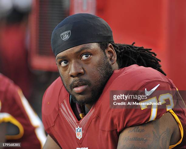 Guard Adam Gettis of the Washington Redskins watches play against the Tampa Bay Buccaneers August 29, 2013 at Raymond James Stadium in Tampa, Florida.