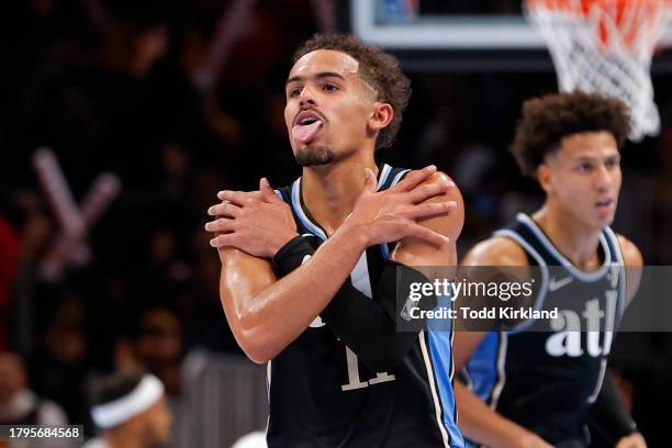 Trae Young of the Atlanta Hawks reacts after dropping a three pointer during the fourth quarter against the Indiana Pacers during an NBA In-Season...