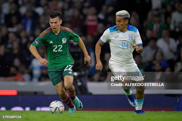 Mexico's Hirving Lozano fights for the ball with Honduras' Andy Najar during the Concacaf Nations League quarterfinals second leg football match...