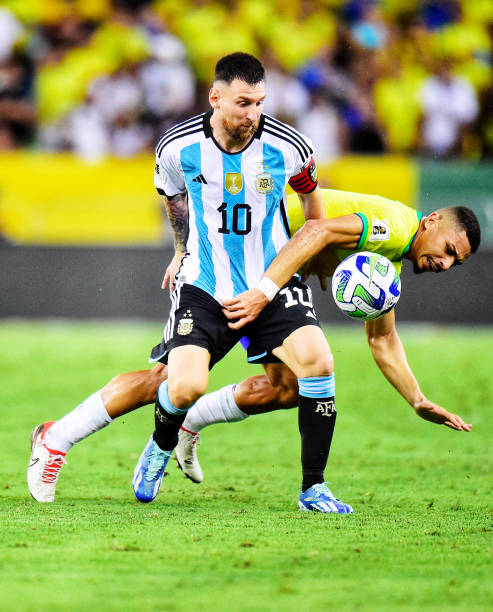 Lionel Messi of Argentina competes for the ball with Andre of Brazil ,during a FIFA World Cup 2026 Qualifier match between Brazil and Argentina at...