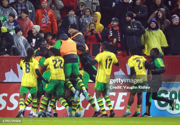 Shamar Nicholson of Jamaica celebrates his second goal with teammates during a CONCACAF Nations League match against Canada at BMO Field on November...