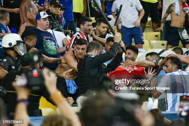 Argentina supporters clash with police officers during FIFA World Cup 2026 Qualifier match between Brazil and Argentina at Maracana Stadium on...