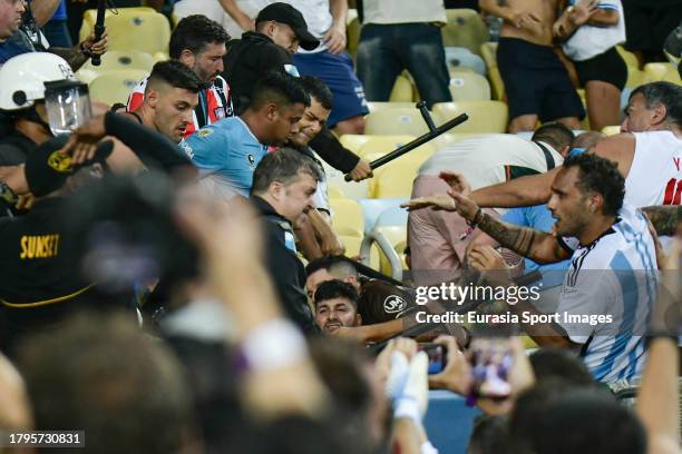 Argentina supporters clash with police officers during FIFA World Cup 2026 Qualifier match between Brazil and Argentina at Maracana Stadium on...