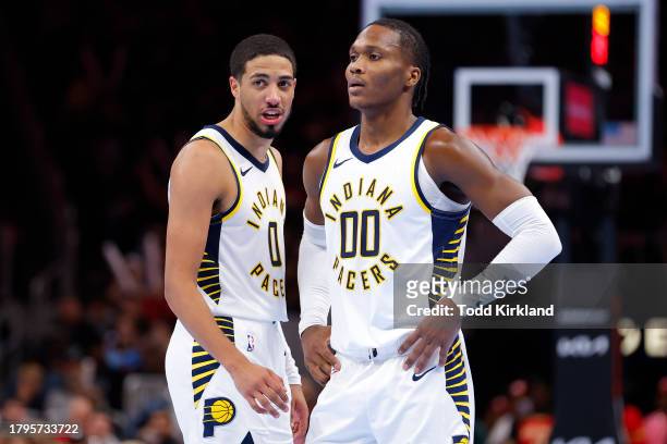 Tyrese Haliburton and Bennedict Mathurin of the Indiana Pacers react during the fourth quarter against the Atlanta Hawks during an NBA In-Season...