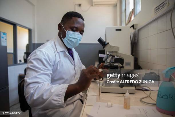 Biomedical and laboratory technician Gabriel Fernando Castigo performs a laboratory test in the maximum security prison of Maputo on November 6,...